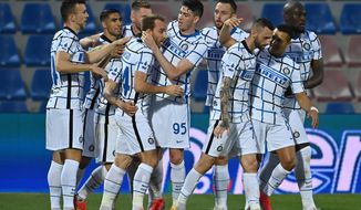Inter Milan&#39;s Christian Eriksen, fourth form left, celebrates after scoring his side&#39;s first goal during the Italian Serie A soccer match between Crotone and Inter Milan at the Ezio Scida Stadium in Crotone, Italy, Saturday, May 1, 2021. (Francesco Mazzitello/LaPresse Via AP)