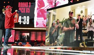 An image of Oklahoma center Creed Humphrey is displayed on a screen after a second-round pick by the Kansas City Chiefs at the NFL football draft Friday, April 30, 2021, in Cleveland. (AP Photo/David Dermer)