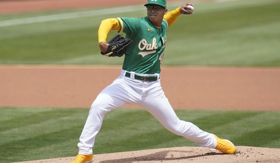 Oakland Athletics&#39; Jesus Luzardo pitches against the Baltimore Orioles during the first inning of a baseball game in Oakland, Calif., Saturday, May 1, 2021. (AP Photo/Jeff Chiu)