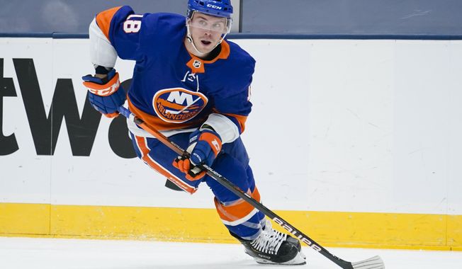 New York Islanders left wing Anthony Beauvillier (18) looks to pass during the second period of an NHL hockey game against the New York Rangers, Saturday, May 1, 2021, in Uniondale, N.Y. (AP Photo/Frank Franklin II)
