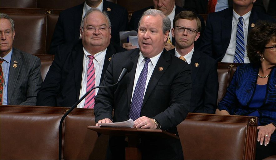 In this Dec. 18, 2019, file photo, Rep. Larry Bucshon, R-Ind., speaks on the House floor at the Capitol in Washington. With vaccination rates lagging in red states, Republican leaders have begun stepping up efforts to persuade their supporters to get the COVID-19 shot, at times combating misinformation spread by some of their own. (House Television via AP)