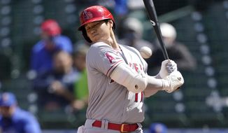 Los Angeles Angels Shohei Ohtani ducks a high and inside pitch during the fifth inning of a baseball game against the Seattle Mariners, Sunday, May 2, 2021, in Seattle. (AP Photo/Ted S. Warren)