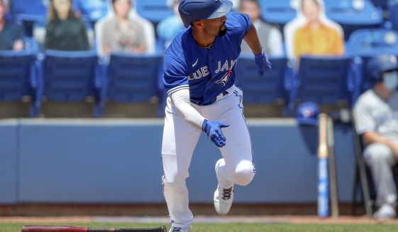 Toronto Blue Jays&#39; Marcus Semien follows through on a two-run double against the Atlanta Braves during the third inning of a baseball game Sunday, May 2, 2021, in Dunedin, Fla. (AP Photo/Mike Carlson)