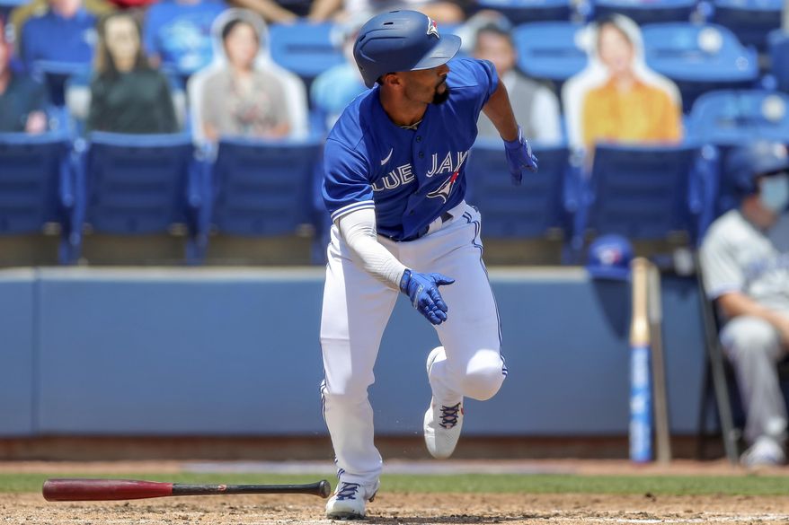 Toronto Blue Jays&#x27; Marcus Semien follows through on a two-run double against the Atlanta Braves during the third inning of a baseball game Sunday, May 2, 2021, in Dunedin, Fla. (AP Photo/Mike Carlson)