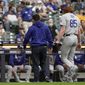 Los Angeles Dodgers starting pitcher Dustin May leaves the game after being injured during the second inning of a baseball game against the Milwaukee Brewers Saturday, May 1, 2021, in Milwaukee. (AP Photo/Morry Gash)