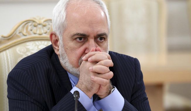 FILE - In this Jan. 26, 2021, file photo released by the Russian Foreign Ministry Press Service, Iranian Foreign Minister Mohammad Javad Zarif listens during the talks in Moscow, Russia. Iran&#x27;s foreign minister apologized Sunday for recorded comments that were leaked to the public last week, creating a firestorm in Iran less than two months before presidential elections.(Russian Foreign Ministry Press Service via AP, File)