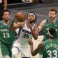 Sacramento Kings forward Marvin Bagley III (35) goes up for a shot between Dallas Mavericks&#x27; Jalen Brunson (13), Willie Cauley-Stein (33) and Nicolo Melli, right rear, in the second half of an NBA basketball game in Dallas, Sunday, May 2, 2021. (AP Photo/Tony Gutierrez)