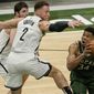 Milwaukee Bucks&#39; Giannis Antetokounmpo shoots past Brooklyn Nets&#39; Blake Griffin during the second half of an NBA basketball game Sunday, May 2, 2021, in Milwaukee. (AP Photo/Morry Gash)