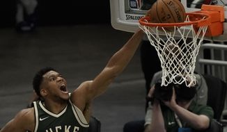 Milwaukee Bucks&#39; Giannis Antetokounmpo dunks during the first half of an NBA basketball game against the Brooklyn Nets Sunday, May 2, 2021, in Milwaukee. (AP Photo/Morry Gash)
