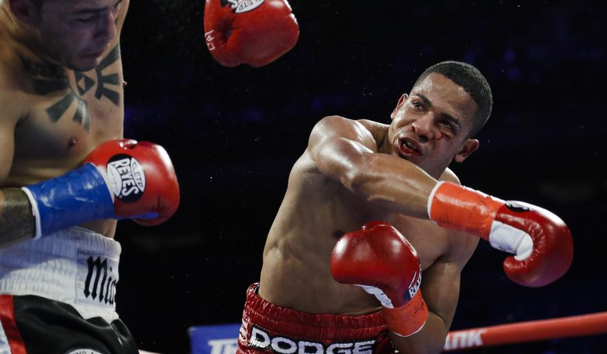In this April 20, 2019 file photo, Puerto Rico&#39;s Felix Verdejo, right, punches Costa Rica&#39;s Bryan Vazquez during the fifth round of a lightweight boxing match in New York. Verdejo has turned himself in to federal agents on Saturday, May 1, 2021, just hours after authorities identified the body of his 27-year-old lover Keishla Rodríguez in a lagoon in the U.S. territory, a couple of days after she was reported missing. (AP Photo/Frank Franklin II, File) **FILE**
