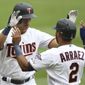 Minnesota Twins&#39; Alex Kirilloff, left, high-fives teammate Luis Arraez (2) after hitting a home run in the eighth inning of a baseball game against the Kansas City Royals, Sunday, May 2, 2021, in Minneapolis. (AP Photo/Stacy Bengs)
