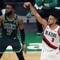 Portland Trail Blazers&#39; CJ McCollum (3) shoots a 3-pointer against Boston Celtics&#39; Jaylen Brown (7) during the second half of an NBA basketball game, Sunday, May 2, 2021, in Boston. (AP Photo/Michael Dwyer)