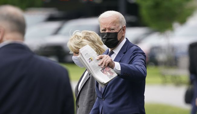 President Joe Biden and first lady Jill Biden arrive to board Marine One on the Ellipse near the White House, Monday, May 3, 2021, in Washington. The Bidens are en route to Virginia. (AP Photo/Patrick Semansky)