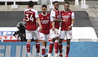 Arsenal&#x27;s Pierre-Emerick Aubameyang, right, celebrates scoring his side&#x27;s second goal with his teammates during the English Premier League soccer match between Newcastle United and Arsenal at St James&#x27; Park stadium, in Newcastle, England, Sunday, May 2, 2021. (Molly Darlington/Pool via AP)