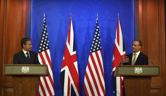 Britain&#39;s Foreign Secretary Dominic Raab, right, and US Secretary of State Antony Blinken attend a joint press conference at Downing Street in London, Monday, May 3, 2021, during the G7 foreign ministers meeting. (Ben Stansall/Pool Photo via AP)