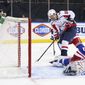 Daniel Sprong, left, of the Washington Capitals scores an unassisted goal in the third period against Igor Shesterkin, right, of the New York Rangers during an NHL hockey game Monday, May 3, 2021, in New York. (Bruce Bennett/Pool Photo via AP)