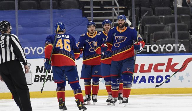St. Louis Blues&#x27; Robert Bortuzzo (41) is congratulated by teammates after scoring a goal against the Anaheim Ducks during the third period of an NHL hockey game on Monday, May 3, 2021, in St. Louis. (AP Photo/Joe Puetz)