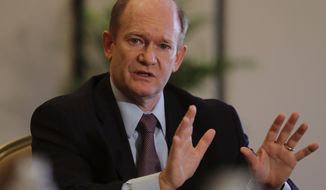 Senator Chris Coons of Delaware talks to the journalists during a press briefing in Abu Dhabi, United Arab Emirates, Monday, May 3, 2021. Top Biden administration officials and U.S. senators crisscrossed the Middle East on Monday, seeking to assuage growing unease among Gulf Arab partners over America’s rapprochement with Iran and other policy shifts in the region. (AP Photo/Kamran Jebreili)