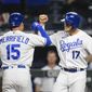 Kansas City Royals Hunter Dozier, right, congratulates Whit Merrifield, left, after Merrifield hit a home run scoring both of them during the fourth inning of a baseball game against the Cleveland Indians Monday, May 3, 2021, in Kansas City, Mo. (AP Photo/Reed Hoffmann)