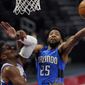 Orlando Magic guard Chasson Randle (25) makes a layup as Detroit Pistons forward Tyler Cook defends during the second half of an NBA basketball game, Monday, May 3, 2021, in Detroit. (AP Photo/Carlos Osorio)