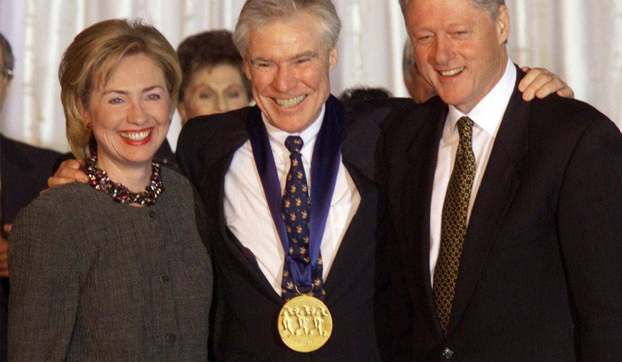 FILE - Dancer-choreographer Jacques d&#x27;Amboise poses with President Bill Clinton, right, and first lady Hillary Rodham Clinton at the White House after D&#x27;Amboise was presented with the National Medal of Arts Award on Nov. 5, 1998. D&#x27;Amboise, who grew up on the streets of upper Manhattan to become one of the world&#x27;s premier classical dancers at New York City Ballet and spent the last four and a half decades providing free dance classes to city youth at his National Dance Institute, died Sunday, May 2, 2021. He was 86. His death was confirmed by Ellen Weinstein, director of the institute. (AP Photo/Doug Mills, File)