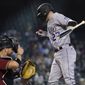 Colorado Rockies&#39; Trevor Story, right, jumps in reaction to being hit by a pitch as Arizona Diamondbacks catcher Stephen Vogt, left, looks on during the eighth inning of a baseball game Sunday, May 2, 2021, in Phoenix.  (AP Photo/Ross D. Franklin)