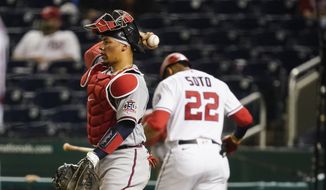Atlanta Braves catcher William Contreras throws the ball back to the pitcher after Washington Nationals&#39; Juan Soto strikes out during the eighth inning of baseball game at Nationals Park, Tuesday, May 4, 2021, in Washington. The Braves won 6-1. (AP Photo/Alex Brandon)