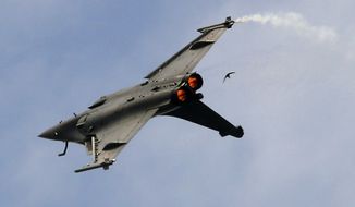 FILE- In this Tuesday, June 18, 2019, file photo, a Dassault Rafale fighter jet performs its demonstration flight at Paris Air Show, in Le Bourget, north east of Paris, France. Egypt is buying another 30 Rafale fighter jets from France, building up its fleet of the advanced warplane to 54, second only to the French Air Force. Both countries confirmed the deal separately on Tuesday. The Egyptian military said the purchase would be financed with a 10-year French loan. The value of the deal wasn&#x27;t given. (AP Photo/ Francois Mori, File)
