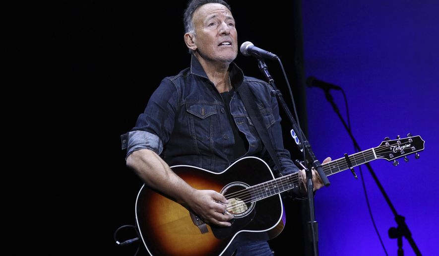 FILE - Bruce Springsteen performs at the 13th annual Stand Up For Heroes benefit concert in support of the Bob Woodruff Foundation in New York on Nov. 4, 2019. Springsteen is this year&#39;s winner of the Woody Guthrie Prize. The award honors artists of any medium who continue the legacy of the Oklahoma songwriter. Springsteen calls Guthrie one of his most important influences. The legendary performer will be honored in a virtual ceremony May 13.  (Photo by Greg Allen/Invision/AP, File)
