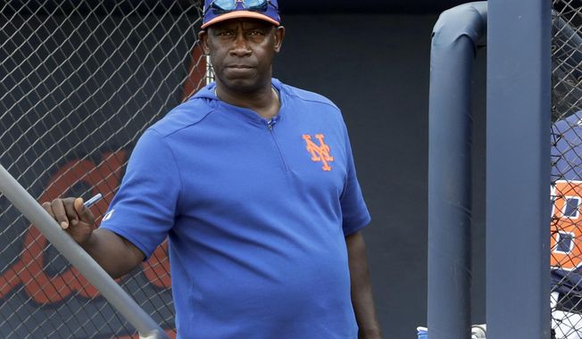 FILE - In this Monday, Feb. 25, 2019, file photo, New York Mets hitting coach Chili Davis watches from the top of the dugout steps during the fifth inning of an exhibition spring training baseball game against the Houston Astros in West Palm Beach, Fla. Late Monday, May 3, 2021, the Mets fired Davis and assistant hitting coach Tom Slater. (AP Photo/Jeff Roberson, File)