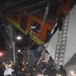 Mexico City fire fighters and rescue personnel work to recover victims from a subway car that fell after a section of Line 12 of the subway collapsed in Mexico City, Monday, May 3, 2021. The section passing over a road in southern Mexico City collapsed Monday night, dropping a subway train, trapping cars and causing at least 50 injuries, authorities said.  (AP Photo/Jose Ruiz)