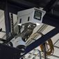 One of the cameras used for automatic balls and strike calls is shown during the first inning of a Low A Southeast league baseball game between the Dunedin Blue Jays and the Tampa Tarpons at George M. Steinbrenner Field Tuesday, May 4, 2021, in Tampa, Fla. The game is one of the first in the league to use automatic calls. (AP Photo/Chris O&#39;Meara)