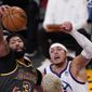 Los Angeles Lakers forward Anthony Davis, left, grabs a rebound away from Denver Nuggets forward Aaron Gordon during the first half of an NBA basketball game Monday, May 3, 2021, in Los Angeles. (AP Photo/Mark J. Terrill)