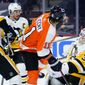 Pittsburgh Penguins&#39; Tristan Jarry (35) blocks a shot as Sidney Crosby (87) Brian Dumoulin (8) and Philadelphia Flyers&#39; Travis Konecny (11) look on during the third period of an NHL hockey game, Tuesday, May 4, 2021, in Philadelphia. (AP Photo/Matt Slocum)