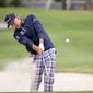 Ian Poulter, of England, hits out of the bunker on the 15th fairway during the second round of the RBC Heritage golf tournament in Hilton Head Island, S.C., Friday, April 16, 2021. (AP Photo/Stephen B. Morton)