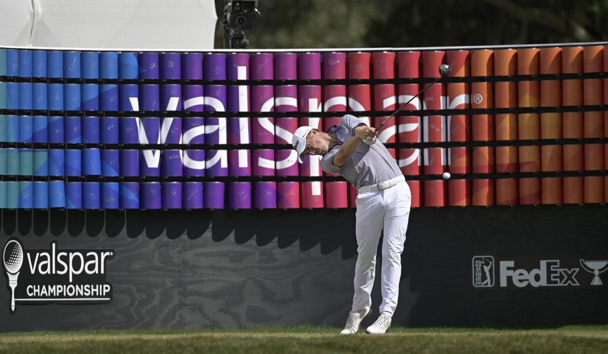 Justin Thomas tees off on the 18th hole during the final round of the Valspar Championship golf tournament, Sunday, May 2, 2021, in Palm Harbor, Fla. (AP Photo/Phelan M. Ebenhack)