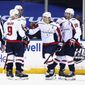 Washington Capitals&#39; T.J. Oshie, center, celebrates his second goal of the night against the New York Rangers, during the second period of an NHL hockey game Wednesday, May 5, 2021, in New York. (Bruce Bennett/Pool Photo via AP)