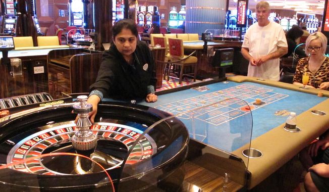 In this June 20, 2019 photo, a game of roulette is underway at the Hard Rock casino in Atlantic City, N.J. A report released Wednesday, May 5, 2021, from a state panel recommended rebuilding Atlantic City&#x27;s Boardwalk, improving the look of its business districts, and embracing the &amp;quot;blue economy&amp;quot; of the ocean to help the seaside gambling resort recover from the COVID-19 pandemic. It also suggested money from legalized marijuana sales could help pay for it.  (AP Photo/Wayne Parry)