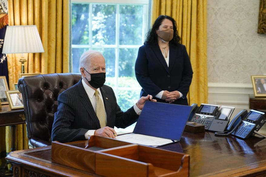 In this March 30, 2021 photo, President Joe Biden signs the PPP Extension Act of 2021, in the Oval Office of the White House in Washington. Small Business Administration administrator Isabel Guzman is at right. Biden is promoting his $28.6 billion program to help the restaurants, bars and food trucks hurt by the coronavirus pandemic. Biden plans to highlight the initiative in a Wednesday afternoon speech.(AP Photo/Evan Vucci)