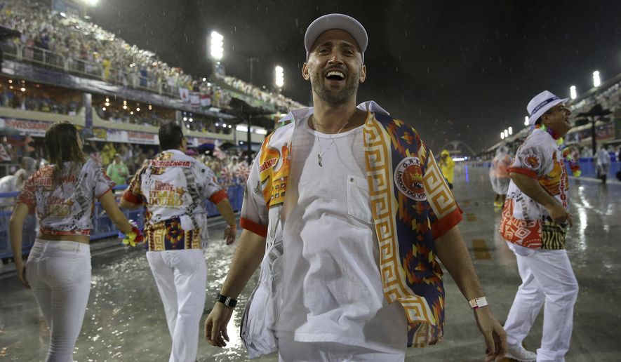 In this Feb. 15, 2015 photo, comedian and actor Paulo Gustavo participates in the Carnival parade at the Sambadrome in Rio de Janeiro, Brazil. The popular comedian died in a Rio hospital from complications related to COVID-19. He was 42. (AP Photo/Bruna Prado)