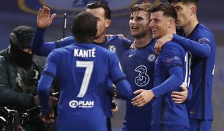 Chelsea&#39;s Timo Werner, third from right, celebrates with his teammates after scoring his side&#39;s first goal during the Champions League semifinal 2nd leg soccer match between Chelsea and Real Madrid at Stamford Bridge in London, Wednesday, May 5, 2021. (AP Photo/Alastair Grant)