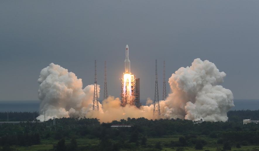 In this April 29, 2021, file photo released by China&#39;s Xinhua News Agency, a Long March 5B rocket carrying a module for a Chinese space station lifts off from the Wenchang Spacecraft Launch Site in Wenchang in southern China&#39;s Hainan Province. (Ju Zhenhua/Xinhua via AP, File)