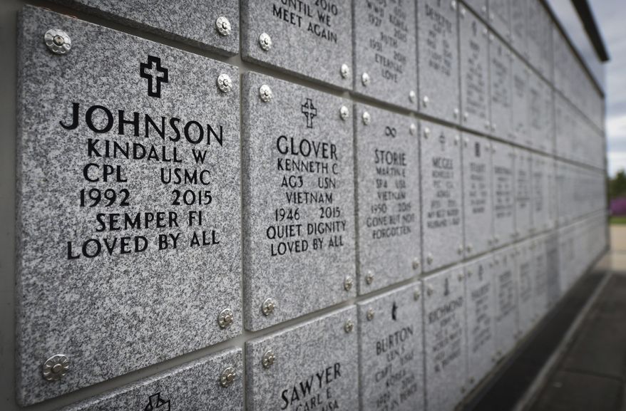 The marker of Cpl. Kindall Johnson, a veteran of the U.S. Marine Corps, who killed himself is displayed amongst other veterans on April 9, 2021, at the Missouri Veterans Cemetery in Springfield, Mo. Federal records on veteran suicide rates are significantly undercounting the actual number of deaths, according to a study's interim report. (Tammy Ljungblad/The Kansas City Star via AP)