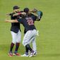 Cleveland Indians outfielders celebrate after their baseball game against the Kansas City Royals Wednesday, May 5, 2021, in Kansas City, Mo. The Indians won 5-4. (AP Photo/Charlie Riedel)