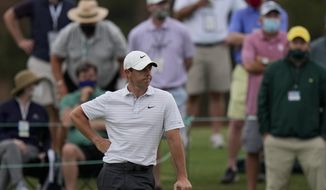 Rory McIlroy, of Northern Ireland waits to putt on the 18th green during the second round of the Masters golf tournament on Friday, April 9, 2021, in Augusta, Ga. (AP Photo/Matt Slocum)