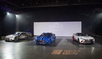 NASCAR unveils the Next Gen Cup cars for the 2022 season during the NASCAR media event in Charlotte, N.C., Wednesday, May 5, 2021. (AP Photo/Mike McCarn)