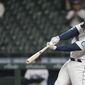 Seattle Mariners&#39; Kyle Seager hits a sacrifice fly to score Sam Haggerty in the eighth inning of a baseball game against the Baltimore Orioles, Tuesday, May 4, 2021, in Seattle. (AP Photo/Ted S. Warren)