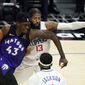 Toronto Raptors forward Pascal Siakam (43) is defended by Los Angeles Clippers guard Paul George (13) during the first half of an NBA basketball game Tuesday, May 4, 2021, in Los Angeles. (AP Photo/Marcio Jose Sanchez)
