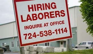 A sign seeking to hire laborers is posted outside a concrete products company in Evans City, Pa., Wednesday, May 5, 2021. A bill by Pennsylvania&#39;s Republican-controlled Legislature to reinstate work-search requirements for people claiming unemployment benefits cleared the House Labor and Industry Committee on a party-line vote Tuesday. Labor and Industry Committee Chairman Jim Cox, R-Berks, contends that employers are having trouble finding workers, and that they often blame the additional $300 per week in federal unemployment benefits during the pandemic and the lack of a work-search requirement. (AP Photo/Keith Srakocic)