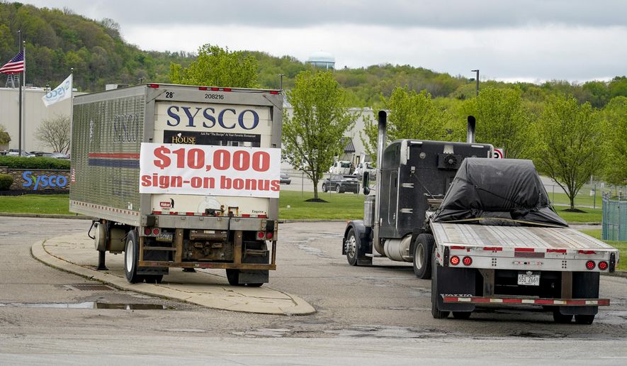 A tractor trailer rig pulls into a terminal for a trucking company that has a $10,000 hiring bonus offer posted on a trailer at their facility in Harmony, Pa., Wednesday, May 5, 2021. A bill by Pennsylvania&#39;s Republican-controlled Legislature to reinstate work-search requirements for people claiming unemployment benefits cleared the House Labor and Industry Committee on a party-line vote Tuesday. The sponsor, Rep. Jim Cox of Berks County, said many employers are having trouble finding workers. (AP Photo/Keith Srakocic) ** FILE **